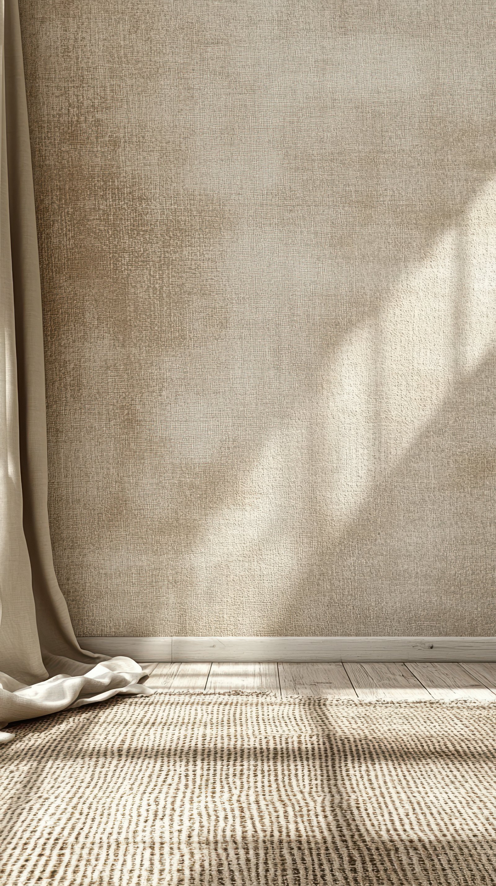 Soft natural light illuminates a cozy interior with textured walls and a simple rug in a calming atmosphere